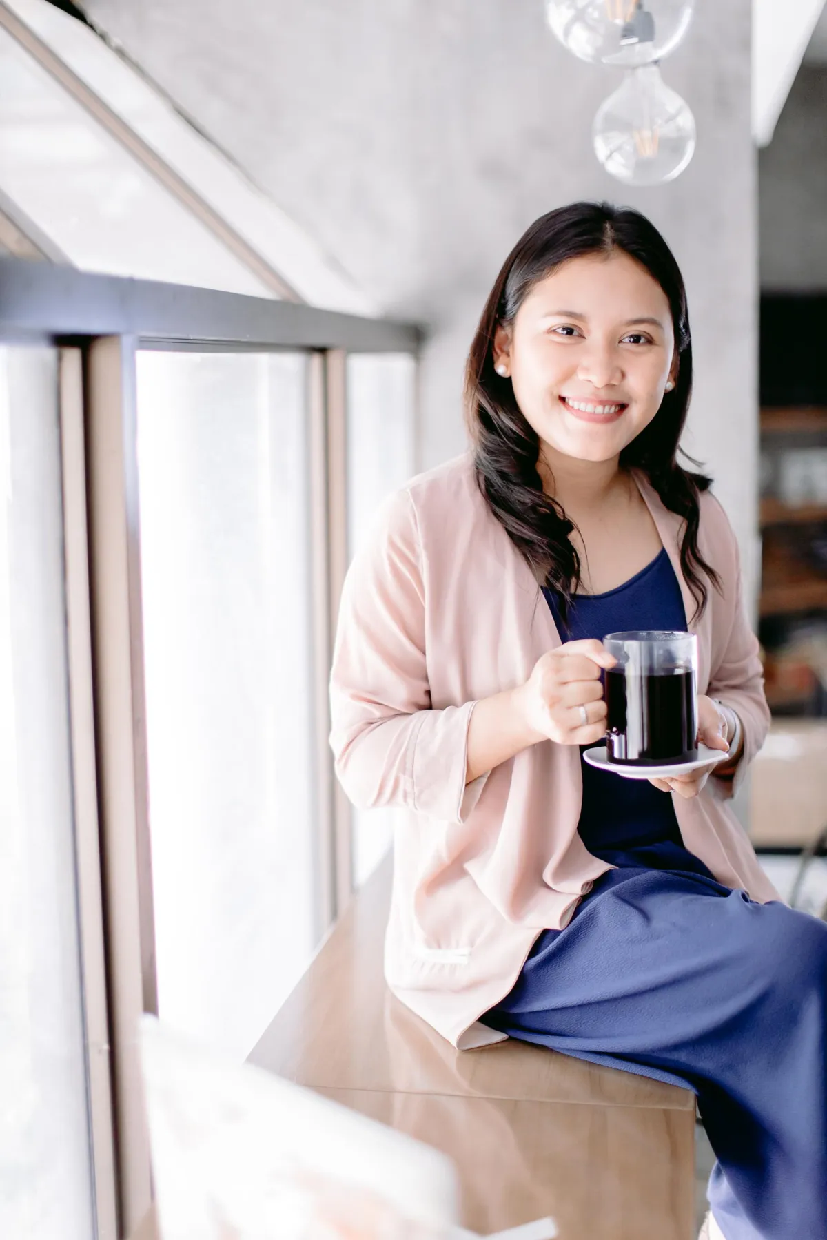 The founder of The Cafe Training Center with a freshly brewed cup
